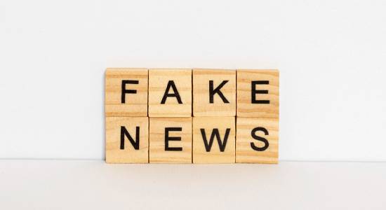 Fake news wooden block letters